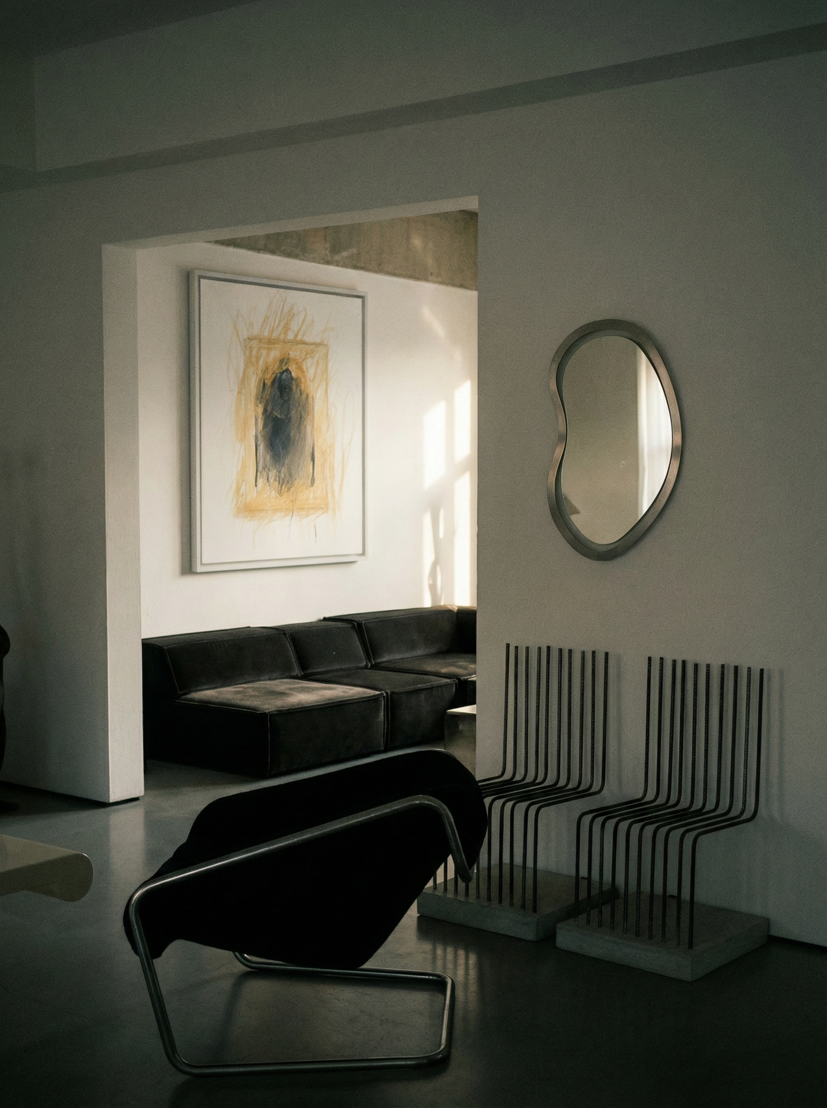 Modern living room with black sofa, abstract art, and unique mirror. Fading figure – Bold Abstract Canvas Print | Large Luxury Wall Art | Brume Art