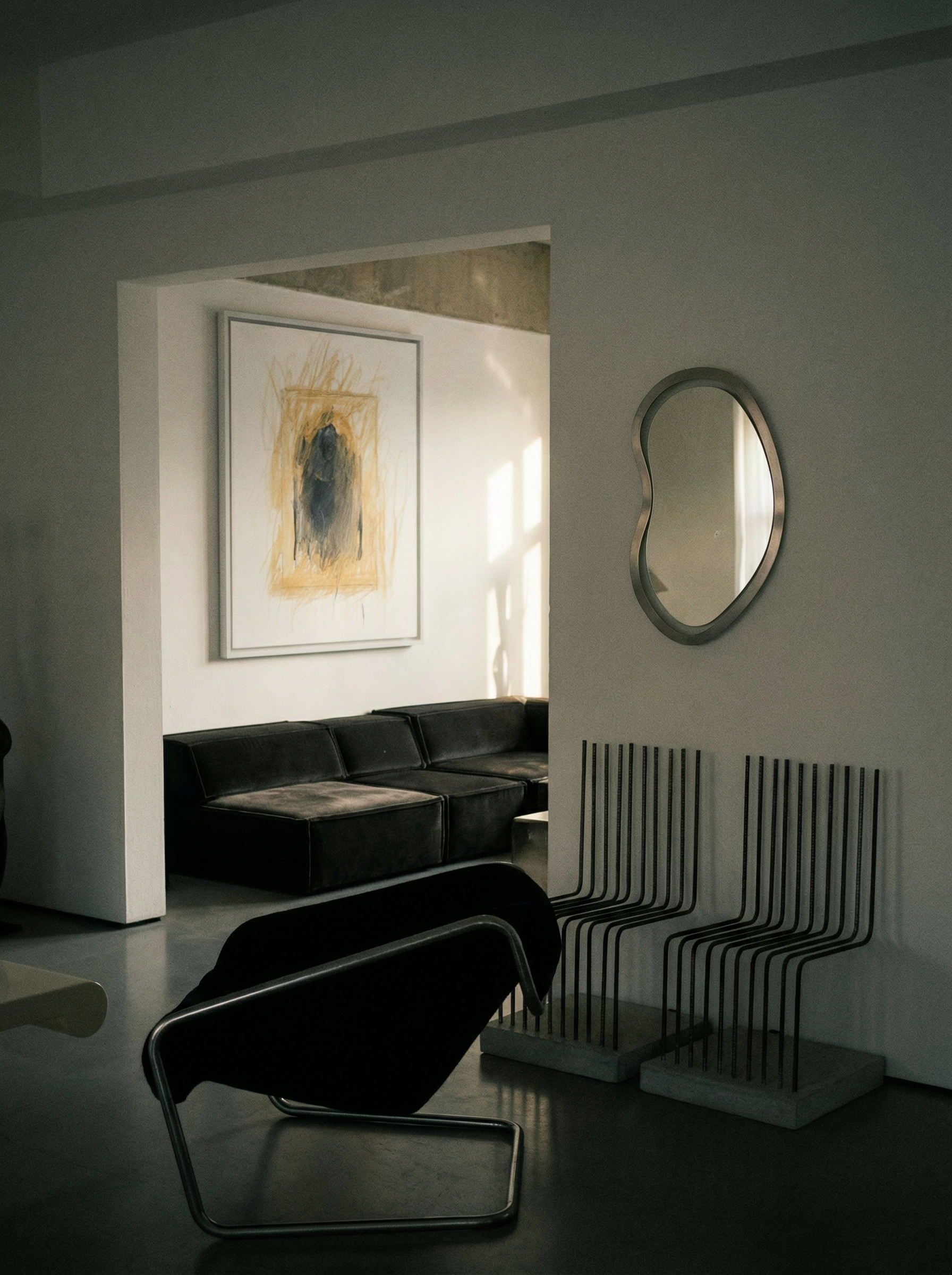Modern living room with black sofa, abstract art, and unique mirror. Fading figure – Bold Abstract Canvas Print | Large Luxury Wall Art | Brume Art