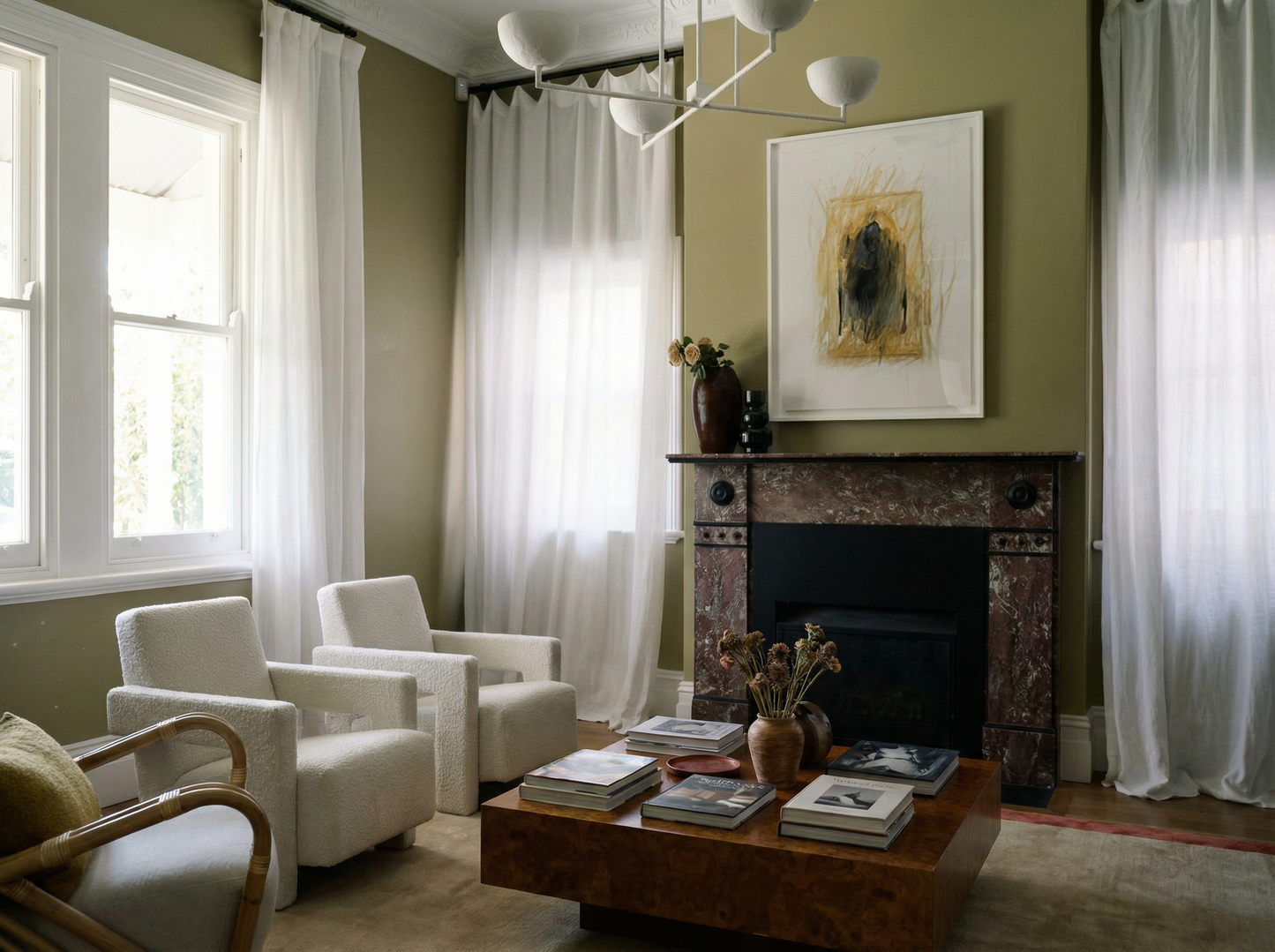 Living room with white chairs, a coffee table, and a fireplace. Fading figure – Bold Abstract Canvas Print | Large Luxury Wall Art | Brume Art