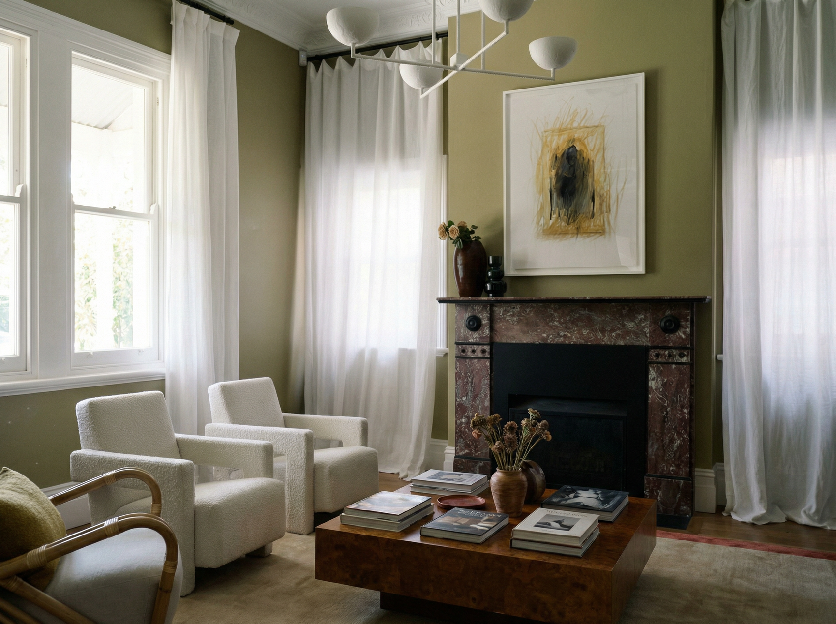 Living room with white chairs, a coffee table, and a fireplace. Fading figure – Bold Abstract Canvas Print | Large Luxury Wall Art | Brume Art