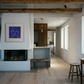 Modern living room with fireplace, bench, and artwork on a white wall. Presence 4 – Figurative Abstract Canvas Print | Large Luxury Wall Art | Brume Art