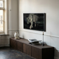 Modern living room with a television mounted on the wall above a wooden console table. Tiger 2 – Contemporary Animal Canvas Art | Luxury Wall Decor | Brume Art | Luxury Wall Decor | Large Canvas Wall Art | Oversized Wall Hanging-Brume art