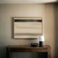 Modern interior with a wooden console table, lamp, and abstract painting on a beige wall. Horizon – Bold Abstract Canvas Print | Large Luxury Wall Art | Brume Art | Luxury Wall Decor | Large Canvas Wall Art | Oversized Wall Hanging-Brume art