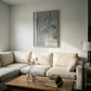 Modern living room with a beige sectional sofa, wooden coffee table, and abstract painting on the wall. Fade – Bold Abstract Canvas Wall Art | Large Luxury Print | Brume Art