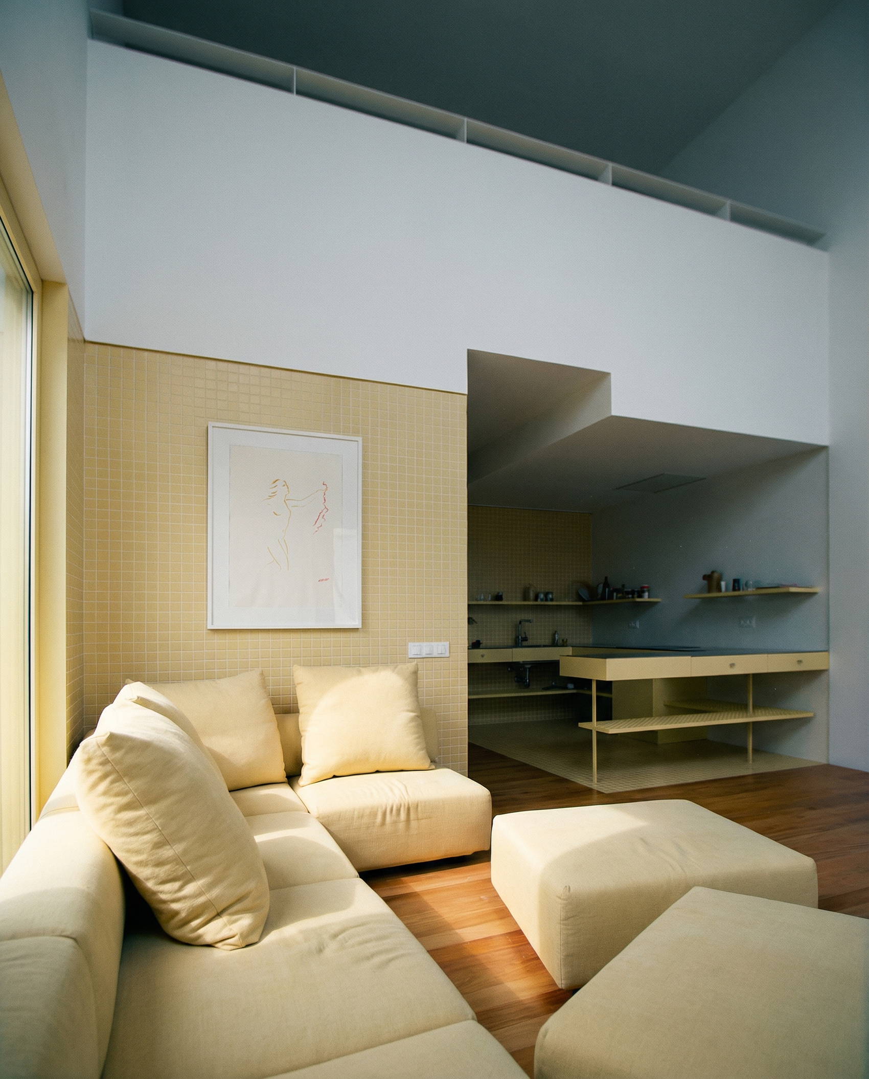 Modern living room with beige sectional sofa and ottomans, wooden floor, and wall art. Reach – Figurative Abstract Canvas Print | Premium Wall Art | Brume Art