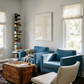 Living room with blue sofa, white armchair, and wooden coffee table. Reach – Figurative Abstract Canvas Print | Premium Wall Art | Brume Art