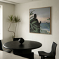 Modern dining room with a black round table and chairs, featuring a large framed painting on the wall. Tycoon – Figurative Canvas Wall Art | Premium Luxury Print | Brume Art| Luxury Wall Decor | Large Canvas Wall Art | Oversized Wall Hanging-Brume art