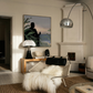 Modern living room with a chair, rug, and artwork on a wall. Tycoon – Figurative Canvas Wall Art | Premium Luxury Print | Brume Art| Luxury Wall Decor | Large Canvas Wall Art | Oversized Wall Hanging-Brume art