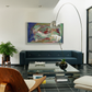Modern living room with a blue sofa, wooden chair, and abstract painting on the wall. Depth – Bold Abstract Canvas Print | Large Luxury Wall Art | Brume Art