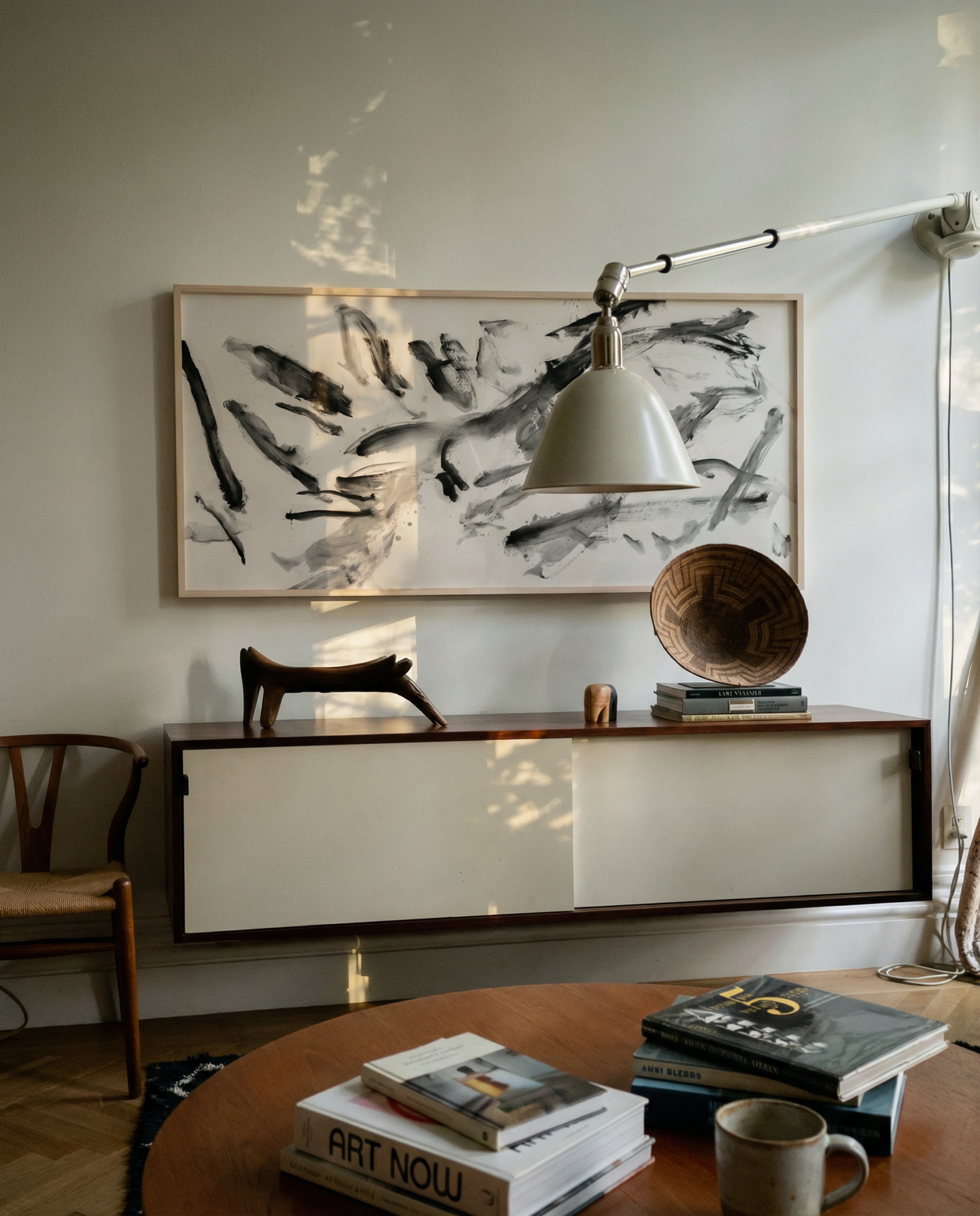 Modern interior with abstract art, console table, and books on a coffee table. Ink 2 – Abstract Ink Canvas Wall Art | Oversized Luxury Print | Brume Art