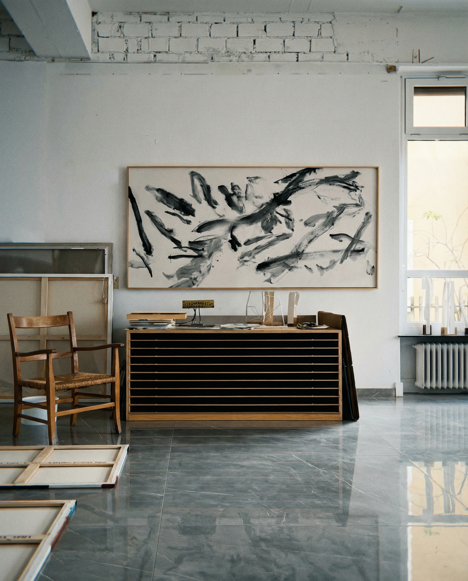 Modern interior with abstract painting on a white wall, wooden furniture, and large windows. Ink 2 – Abstract Ink Canvas Wall Art | Oversized Luxury Print | Brume Art