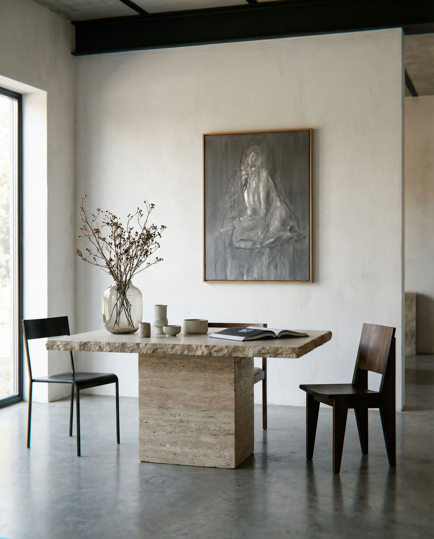 Modern dining room with a stone table, chairs, and a large painting on the wall. Still 2 – Serene Abstract Canvas Print | Premium Luxury Wall Art | Brume Art