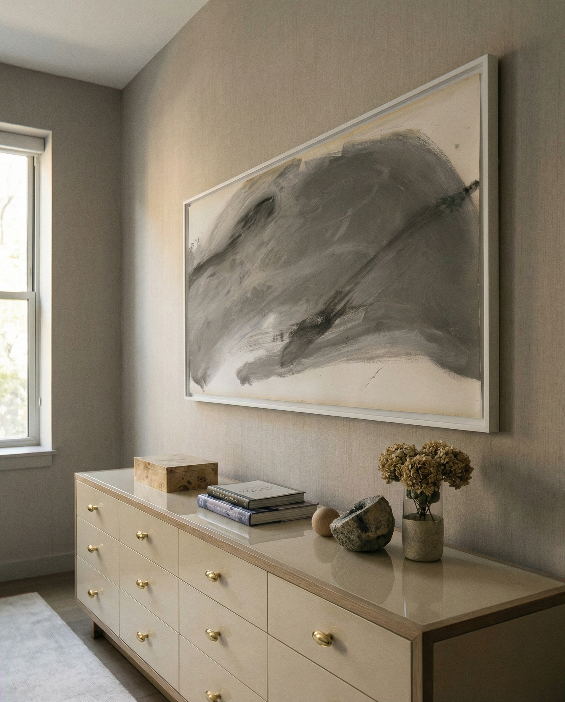 Beige dresser with decorative items against a wall with a large abstract painting. Fade 3 – Minimalist Abstract Canvas Art | Large Luxury Wall Print | Brume Art | Luxury Wall Decor | Large Canvas Wall Art | Oversized Wall Hanging-Brume art