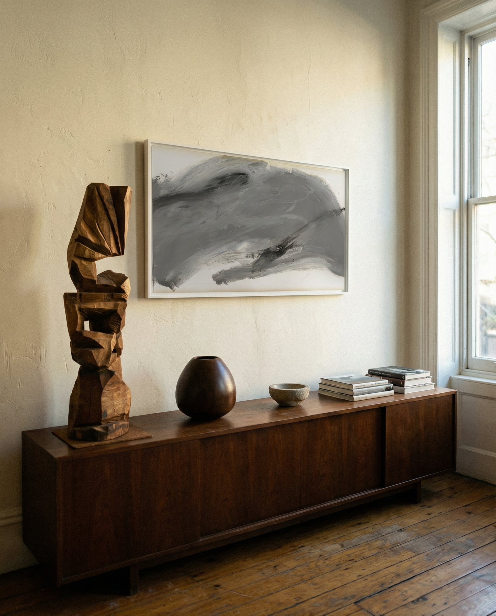 Wooden sideboard with decorative items in a room with a large window. Fade 3 – Minimalist Abstract Canvas Art | Large Luxury Wall Print | Brume Art | Luxury Wall Decor | Large Canvas Wall Art | Oversized Wall Hanging-Brume art