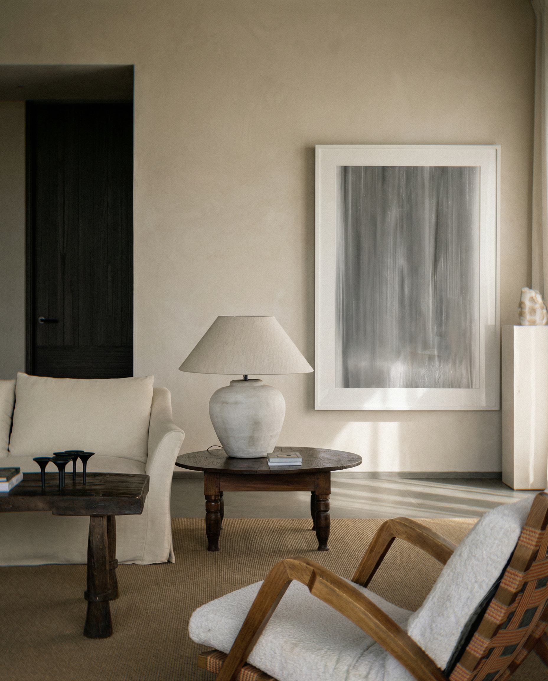 Living room with a lamp, table, and abstract painting on a beige wall. fade 2 – Minimalist Abstract Canvas Art | Large Luxury Wall Print | Brume Art | Luxury Wall Decor | Large Canvas Wall Art | Oversized Wall Hanging-Brume art