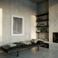 Modern living room with concrete walls, a black leather bench, and shelves with books and decor. fade 2 – Minimalist Abstract Canvas Art | Large Luxury Wall Print | Brume Art | Luxury Wall Decor | Large Canvas Wall Art | Oversized Wall Hanging-Brume art