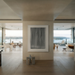 Modern interior with a large abstract painting on a wall, large windows, and minimal decor. fade 2 – Minimalist Abstract Canvas Art | Large Luxury Wall Print | Brume Art | Luxury Wall Decor | Large Canvas Wall Art | Oversized Wall Hanging-Brume art