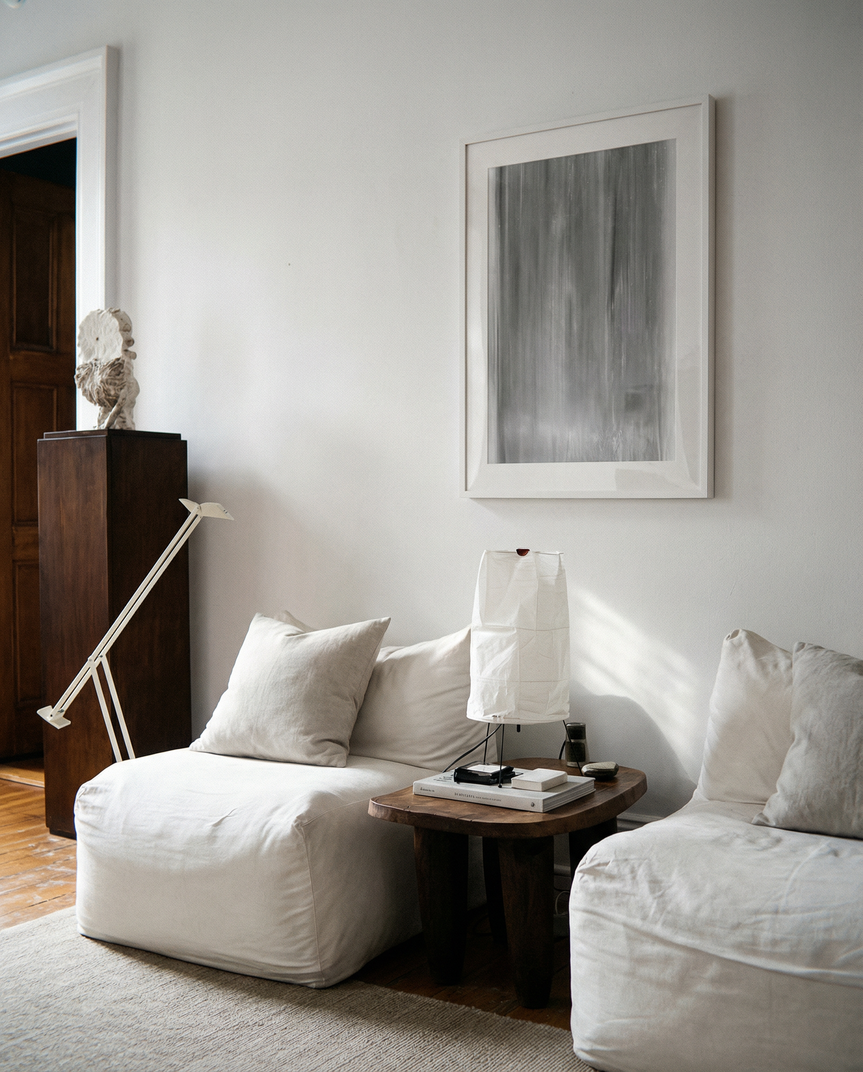 Modern living room with white sofa, wooden side table, and abstract art on wall. fade 2 – Minimalist Abstract Canvas Art | Large Luxury Wall Print | Brume Art | Luxury Wall Decor | Large Canvas Wall Art | Oversized Wall Hanging-Brume art