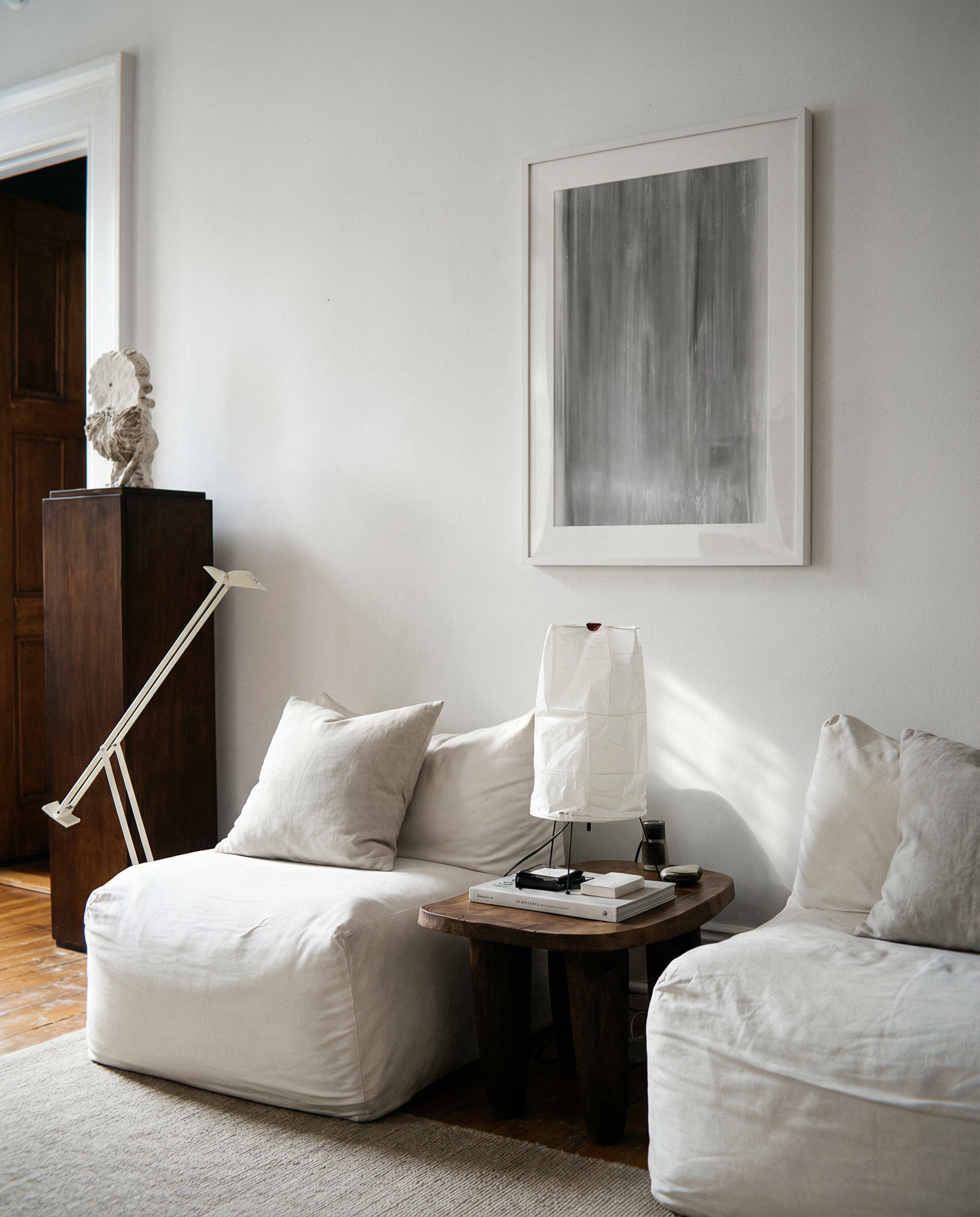 Modern living room with white sofa, wooden side table, and abstract art on wall. fade 2 – Minimalist Abstract Canvas Art | Large Luxury Wall Print | Brume Art | Luxury Wall Decor | Large Canvas Wall Art | Oversized Wall Hanging-Brume art