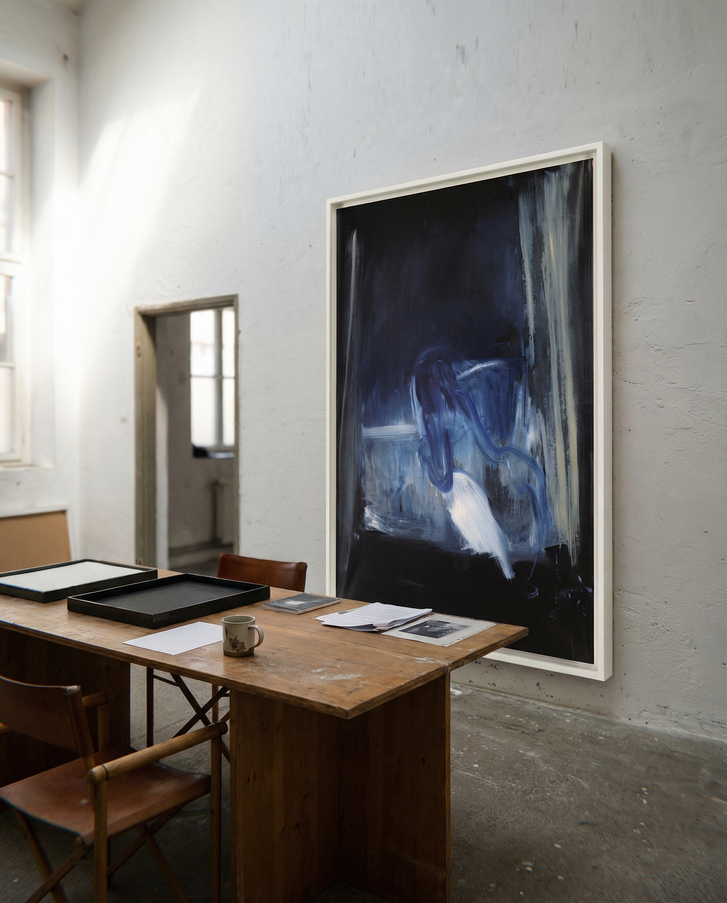 Room with a wooden desk, chairs, and a large abstract painting on the wall. Field black – Landscape Canvas Wall Art | Large Luxury Print | Brume Art