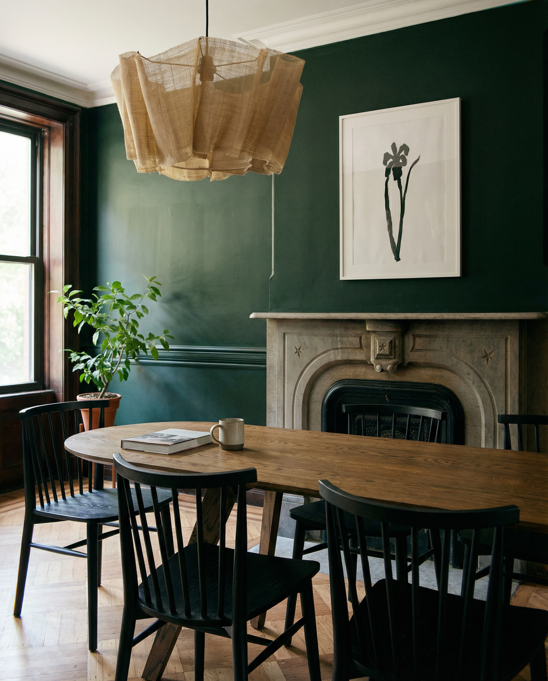 Dining room with wooden table, black chairs, and a fireplace. Blossom – Botanical Canvas Wall Art | Large Luxury Print | Brume Art