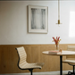 Modern interior with a round table, chairs, and a framed picture on the wall. fade 4– Bold Abstract Canvas Print | Large Luxury Wall Art | Brume Art| Luxury Wall Decor | Large Canvas Wall Art | Oversized Wall Hanging-Brume art