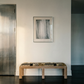 Wooden bench in front of a white wall with a framed abstract painting fade 4– Bold Abstract Canvas Print | Large Luxury Wall Art | Brume Art| Luxury Wall Decor | Large Canvas Wall Art | Oversized Wall Hanging-Brume art