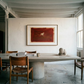 Dining area with a large table and chairs, featuring a red abstract painting on the wall. silent run – Contemporary Animal Canvas Art | Luxury Wall Decor | Brume Art
