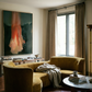 Living room with a yellow sofa, coffee table, and large abstract painting on the wall. Flame – Expressive Abstract Canvas Art | Large Luxury Wall Print | Brume Art