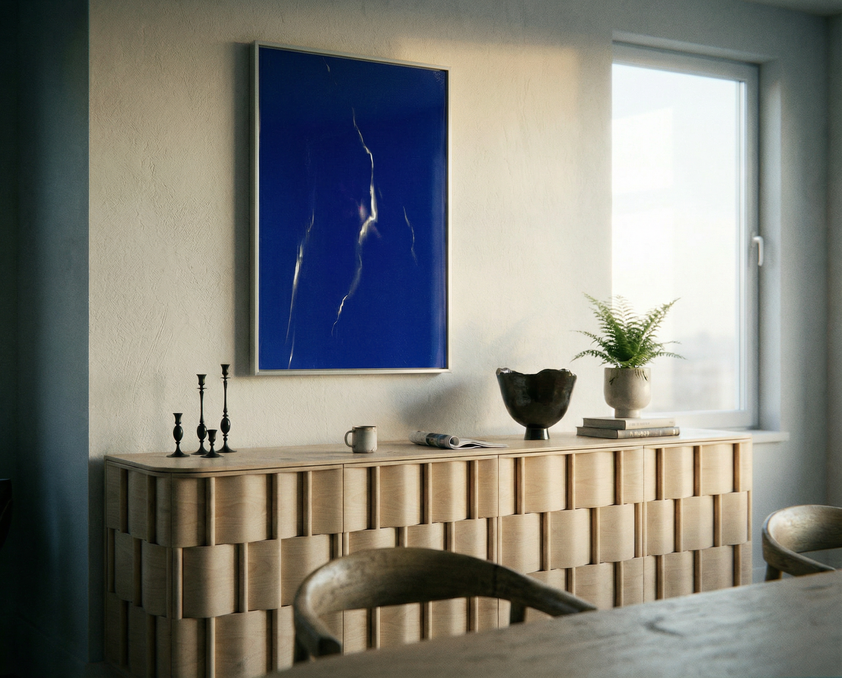 Modern interior with a wooden console table, blue abstract painting, and a plant. Strike – Bold Abstract Canvas Wall Art | Large Luxury Print | Brume Art