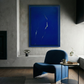 Modern interior with a blue armchair and abstract art on the wall. Strike – Bold Abstract Canvas Wall Art | Large Luxury Print | Brume Art