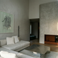 Modern living room with gray walls, a gray sofa, and a fireplace. tension 3 – Textured Abstract Canvas Art | Premium Luxury Wall Decor | Brume Art