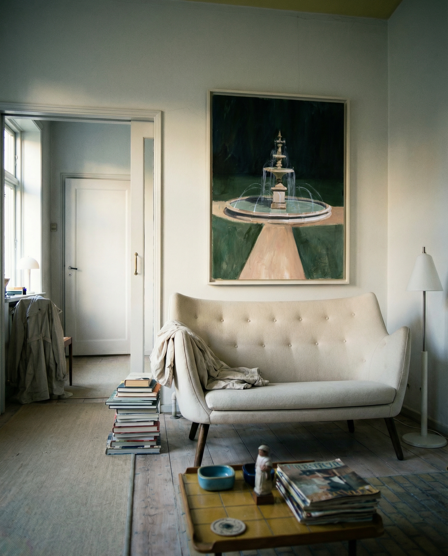 Living room with a beige sofa, coffee table, and artwork on the wall. The Fountain – Abstract Canvas Wall Art | Large Luxury Print | Brume Art