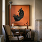 Living room with a black dog painting on an orange background, a chair, and a side table. Black dog – Contemporary Animal Canvas Art | Luxury Wall Decor | Brume Art | Luxury Wall Decor | Large Canvas Wall Art | Oversized Wall Hanging-Brume art