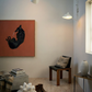 Modern interior with a black horse painting, wooden chair, and decorative items. Black dog – Contemporary Animal Canvas Art | Luxury Wall Decor | Brume Art | Luxury Wall Decor | Large Canvas Wall Art | Oversized Wall Hanging-Brume art