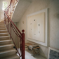Staircase with red railing and wall art in a home interior.  Birds – Nature Canvas Wall Art | Large Luxury Print | Brume Art