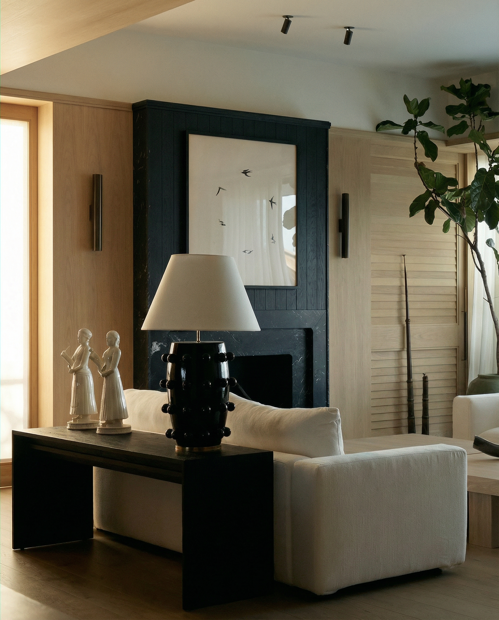 Modern living room with white sofa, black coffee table, and decorative elements.  Birds – Nature Canvas Wall Art | Large Luxury Print | Brume Art