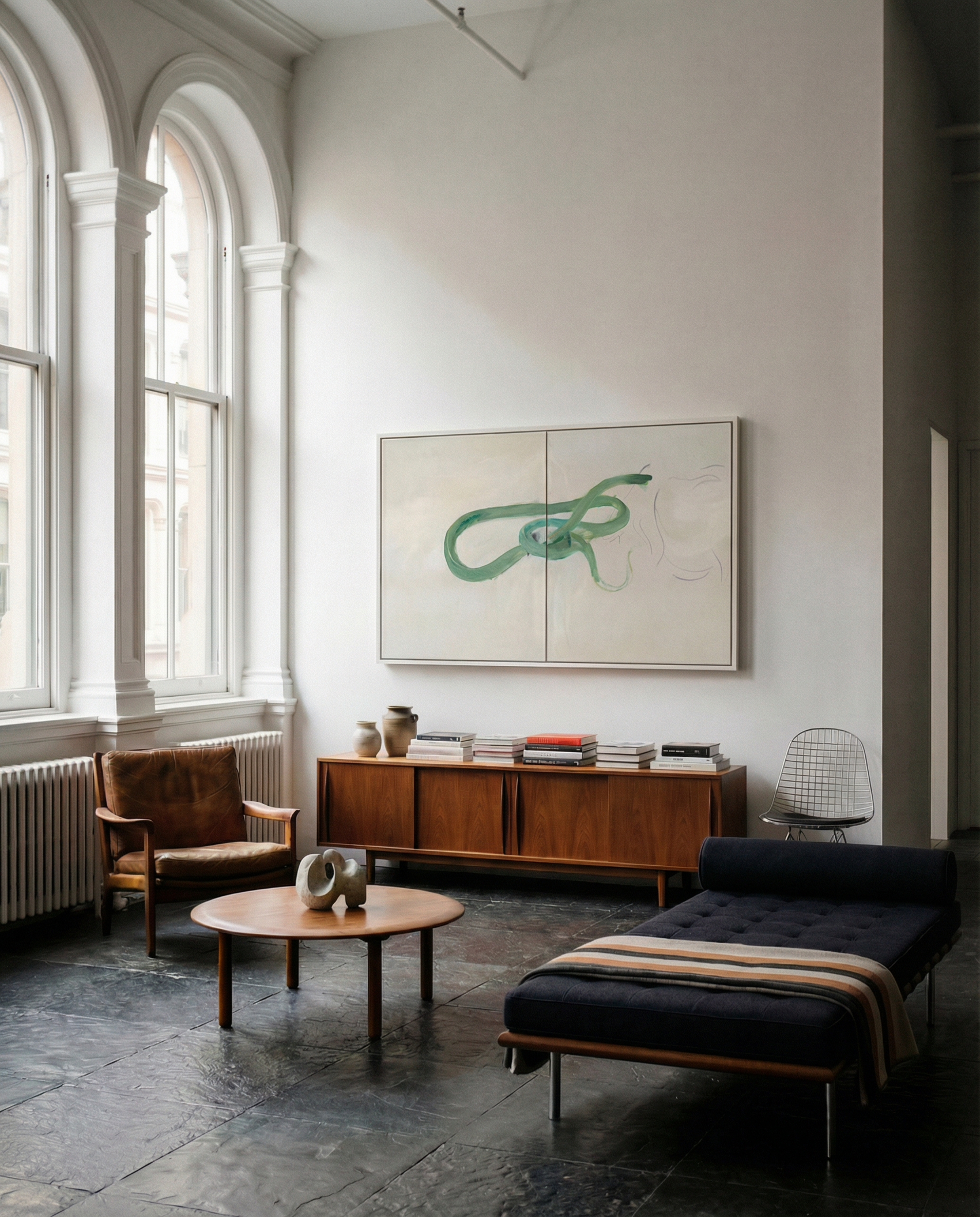 Modern living room with a large abstract painting on the wall, a wooden sideboard, and a chaise lounge. Green Snake – Nature Canvas Wall Art | Large Luxury Print | Brume Art