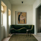 Modern interior with a green sofa, abstract painting, and wooden stool. Girl with Short Hair – Portrait Canvas Art | Luxury Wall Decor | Brume Art