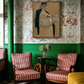 Vintage-style room with striped chairs, a small table, and a painting on floral wallpaper.Girl with Short Hair – Portrait Canvas Art | Luxury Wall Decor | Brume Art