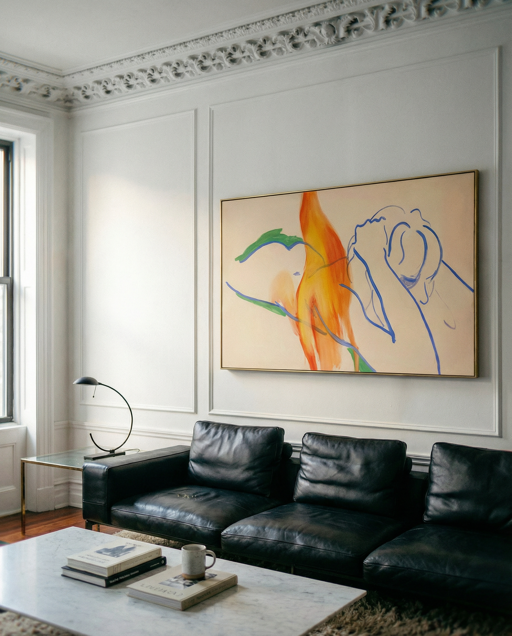 Living room with black leather sofa, abstract painting on wall, and coffee table. Figure and Flame – Figurative Canvas Wall Art | Premium Luxury Print | Brume Art