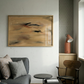 Modern living room with gray sofa, wooden chair, and abstract painting on wall. Abstract painting with brown and black brush strokes on a beige background Field Yellow 2 – Landscape Canvas Wall Art | Premium Luxury Print | Brume Art