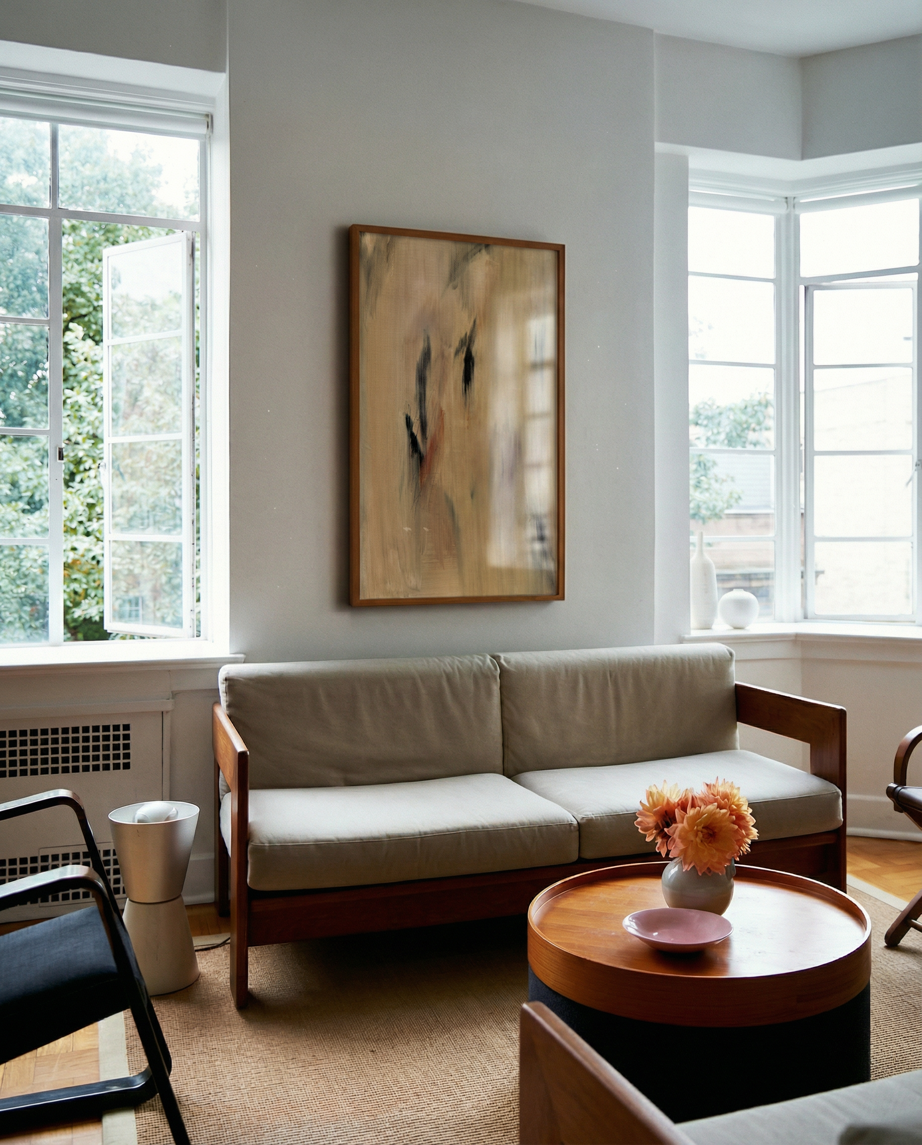Living room with a beige sofa, wooden coffee table, and abstract painting on the wall. Abstract painting with brown and black brush strokes on a beige background Field Yellow 2 – Landscape Canvas Wall Art | Premium Luxury Print | Brume Art