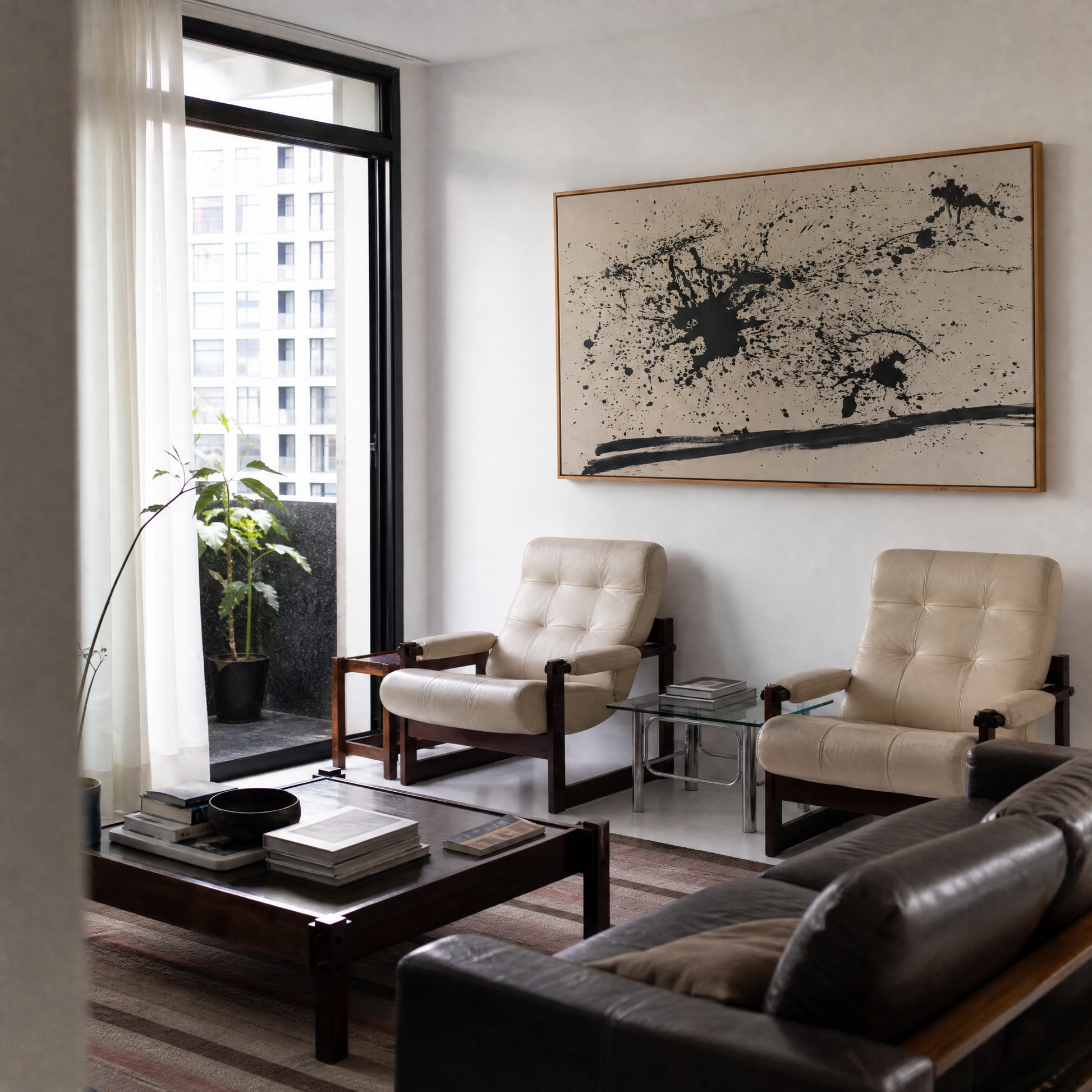 Modern living room with beige armchairs, a dark leather sofa, and abstract art on the wall. Abstract Ink Canvas Wall Art | Large Premium Print | Brume Art | Luxury Wall Decor | Large Canvas Wall Art | Oversized Wall Hanging-Brume art