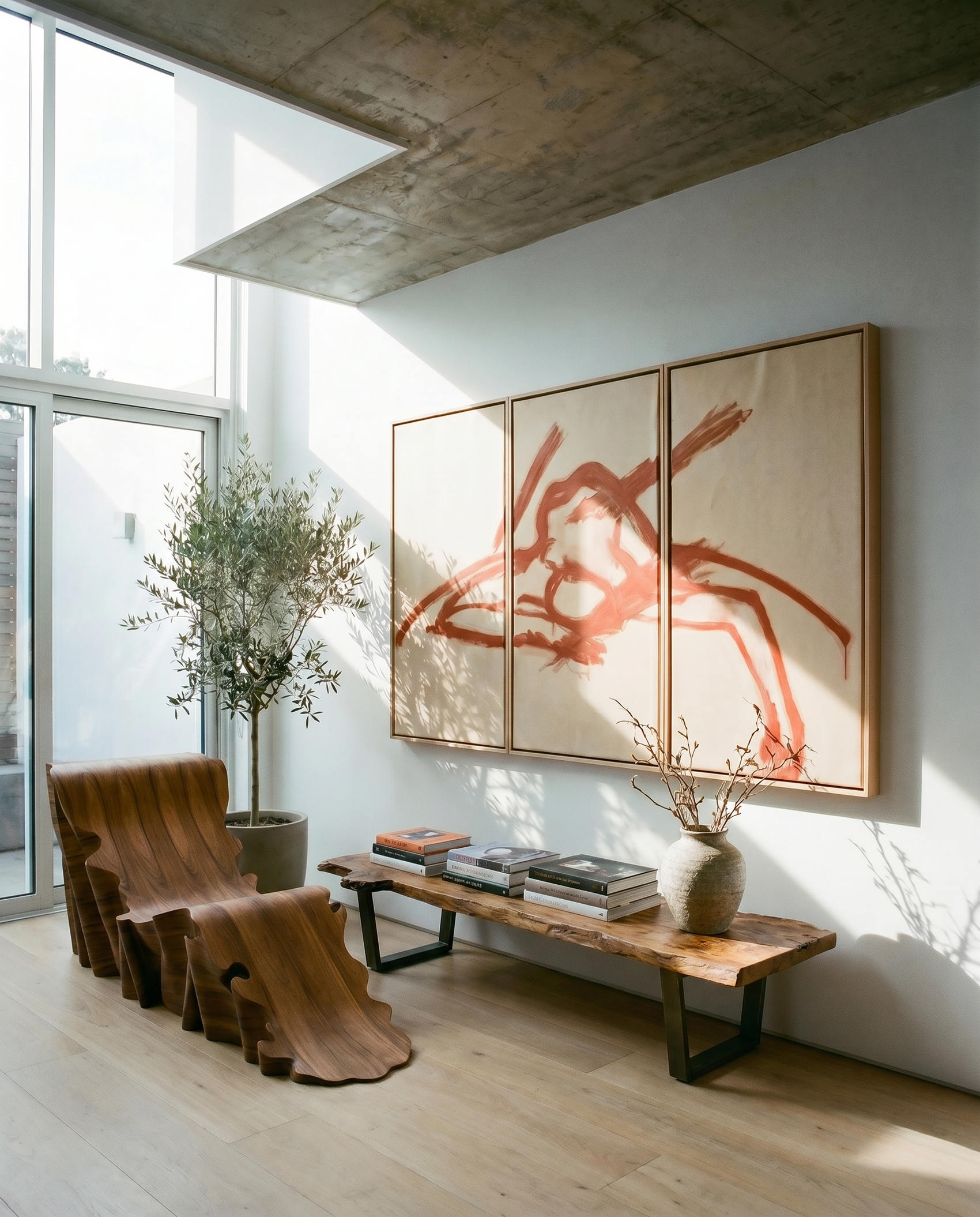 Modern living room with abstract art, wooden bench, and plant