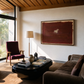 Modern living room with brown sofas, a coffee table, and a large abstract painting on the wall. silent run – Contemporary Animal Canvas Art | Luxury Wall Decor | Brume Art