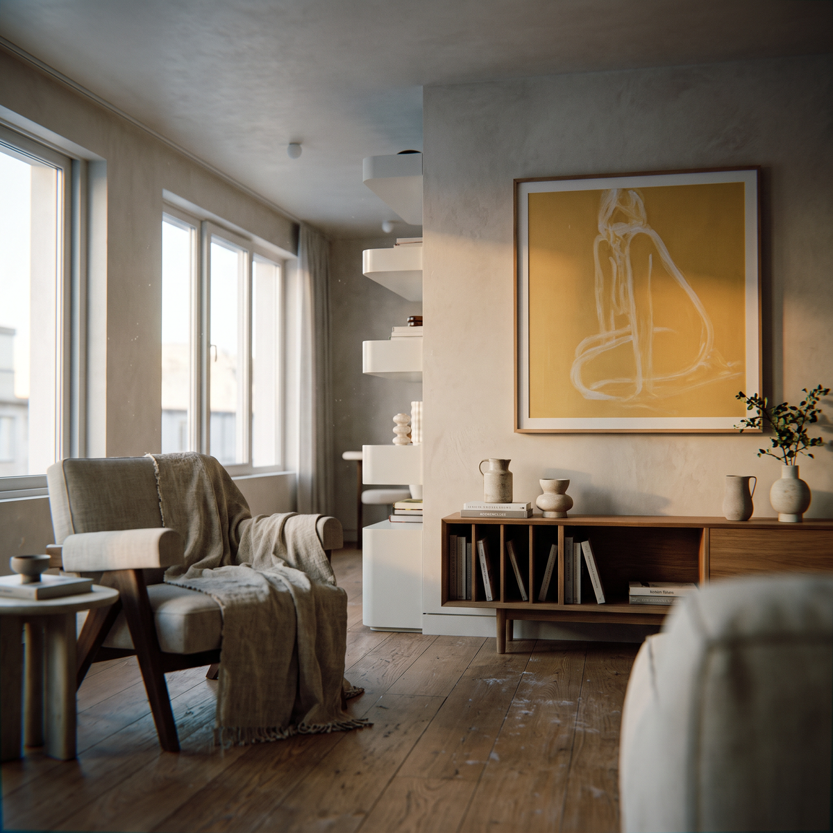 A warm, modern living room interior with a beige armchair draped in a throw blanket, a wooden sideboard with books and vases, and a large framed yellow abstract artwork on the wall.