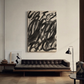 Modern living room with a black leather sofa and abstract painting on the wall. Noise 2 – Textured Abstract Canvas Art | Premium Luxury Wall Decor | Brume Art