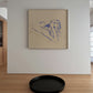 Framed abstract artwork on a wall with a black round tray on the floor in front. Presence 3 – Figurative Abstract Canvas | Premium Wall Art | Brume Art | Luxury Wall Decor | Large Canvas Wall Art | Oversized Wall Hanging-Brume art