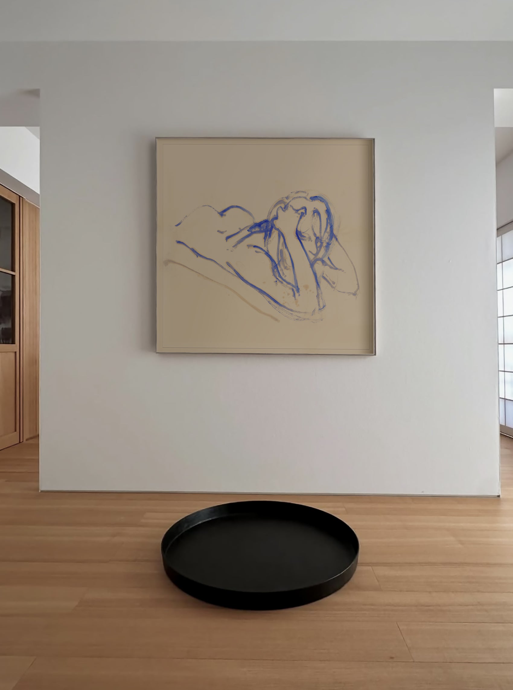 Framed abstract artwork on a wall with a black round tray on the floor in front. Presence 3 – Figurative Abstract Canvas | Premium Wall Art | Brume Art | Luxury Wall Decor | Large Canvas Wall Art | Oversized Wall Hanging-Brume art